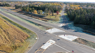 Graphic: Researchers checkout vegatation along a road.